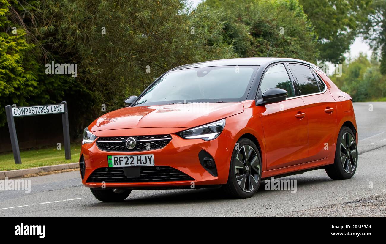 Whittlebury,Northants,UK -Aug 26th 2023: 2022 orange Vauxhall Corsa E Elite  Premium electric car travelling on an English country road Stock Photo -  Alamy