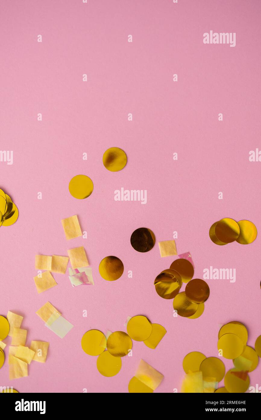 Confetti on pink background in a festive flat-lay Stock Photo