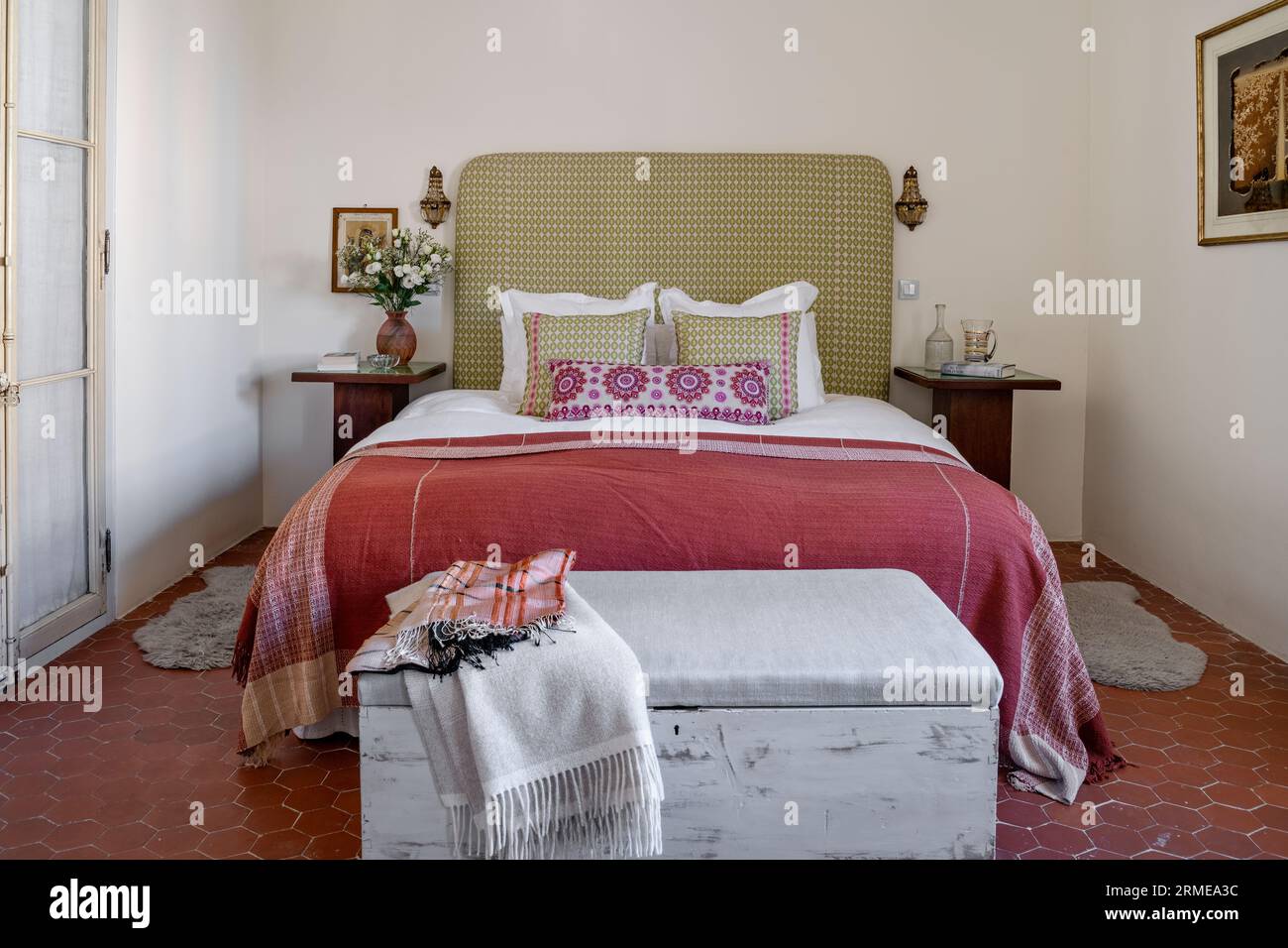 Linen bed covers and blanket box in former grenier of Cotignac manor
