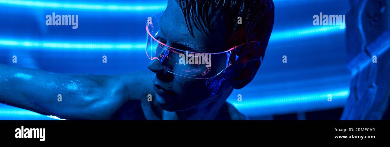 futuristic science concept, cosmic alien in goggles in neon-lit ...