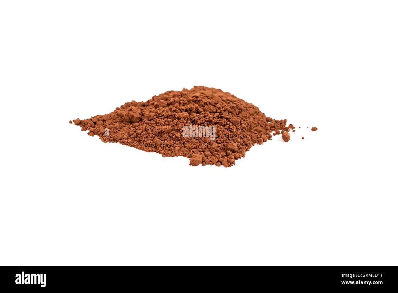 Leaf shaped cocoa powder pile, close up isolated on white Stock Photo