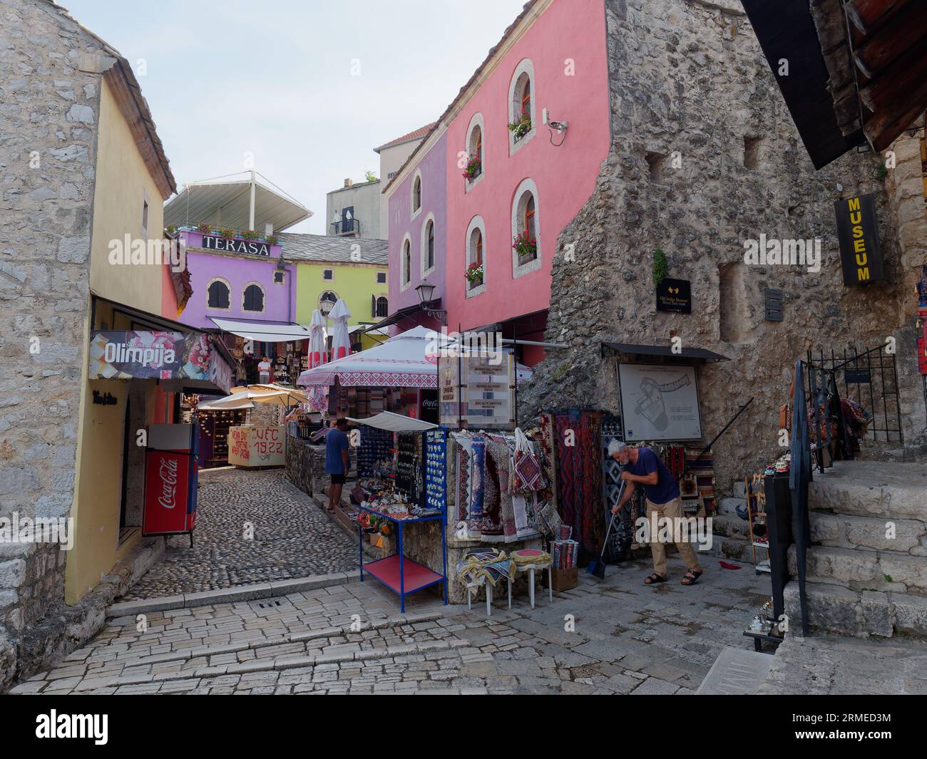Souvenir shops and restaurants in Mostar colourful cobbled old town Unesco site. Bosnia and Herzegovina, August 28, 2023. Stock Photo