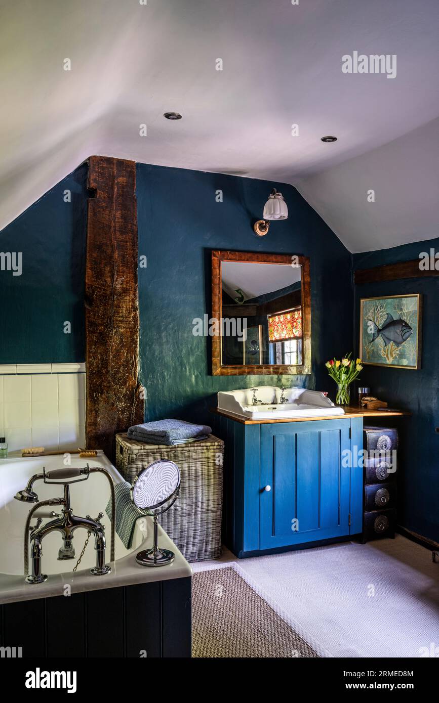 https://c8.alamy.com/comp/2RMED8M/blue-wash-stand-in-teal-timber-framed-bathroom-of-tudor-farmhouse-surrey-uk-2RMED8M.jpg