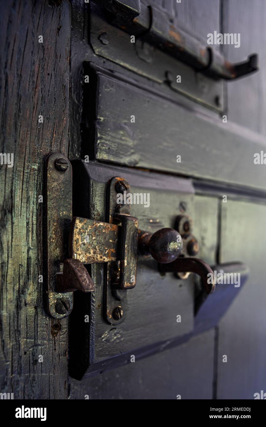 Old fashioned door latch in Tudor farmhouse, Surrey, UK Stock Photo