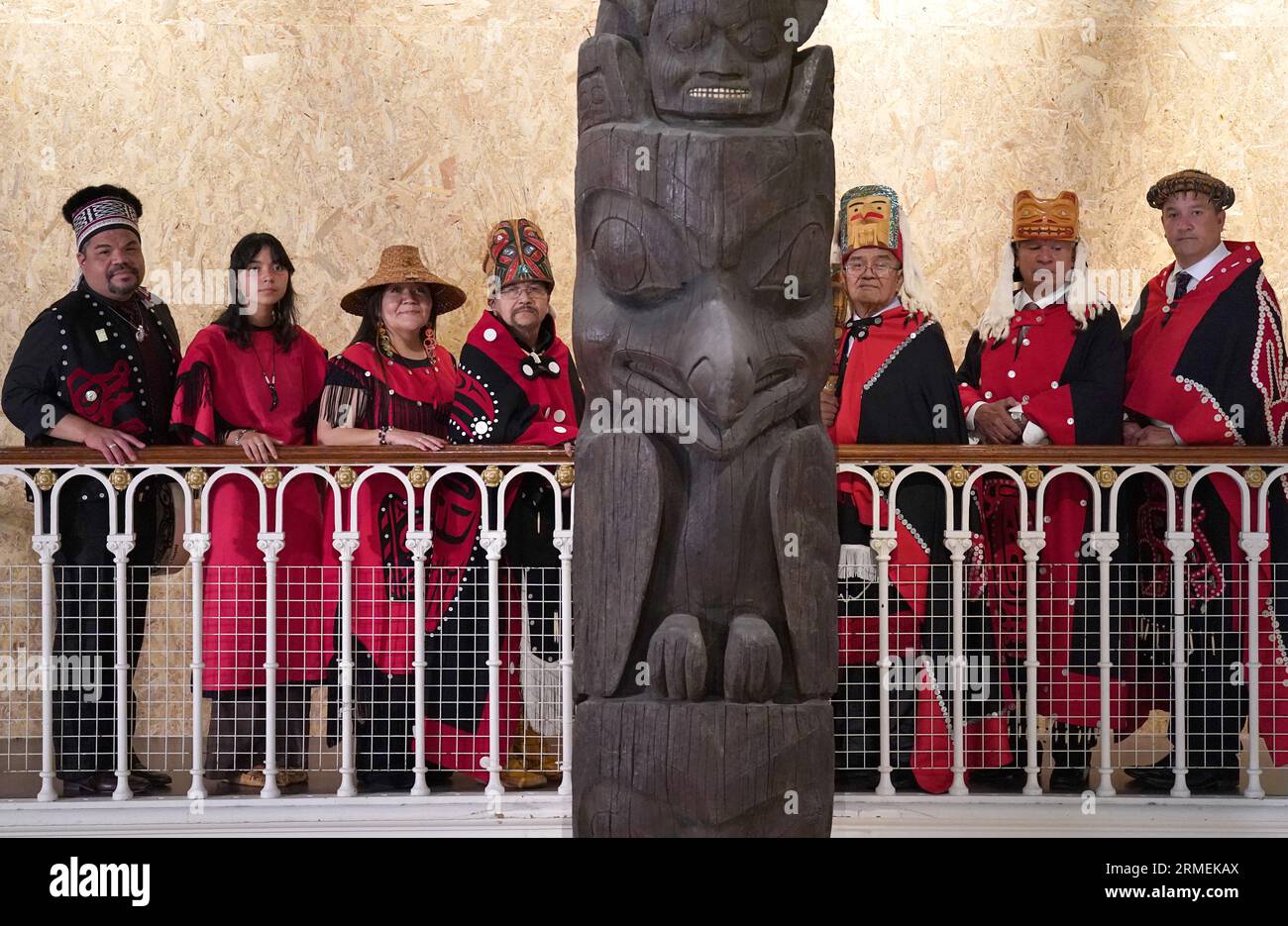 Earl Stephen's(who has the Nisga'a cultural name Chief Ni'is Joohl) with a delegation from the Nisga'a nation beside the 11-metre tall memorial pole during a visit to the National Museum of Scotland in Edinburgh, ahead of the return of 11-metre tall memorial pole to what is now British Columbia. The Nisga'a Lisims Government (NLG) and National Museums Scotland (NMS) announced last month that the House of Ni'isjoohl memorial pole will return home to the Nass Valley this September. Picture date: Monday August 28, 2023. Stock Photo