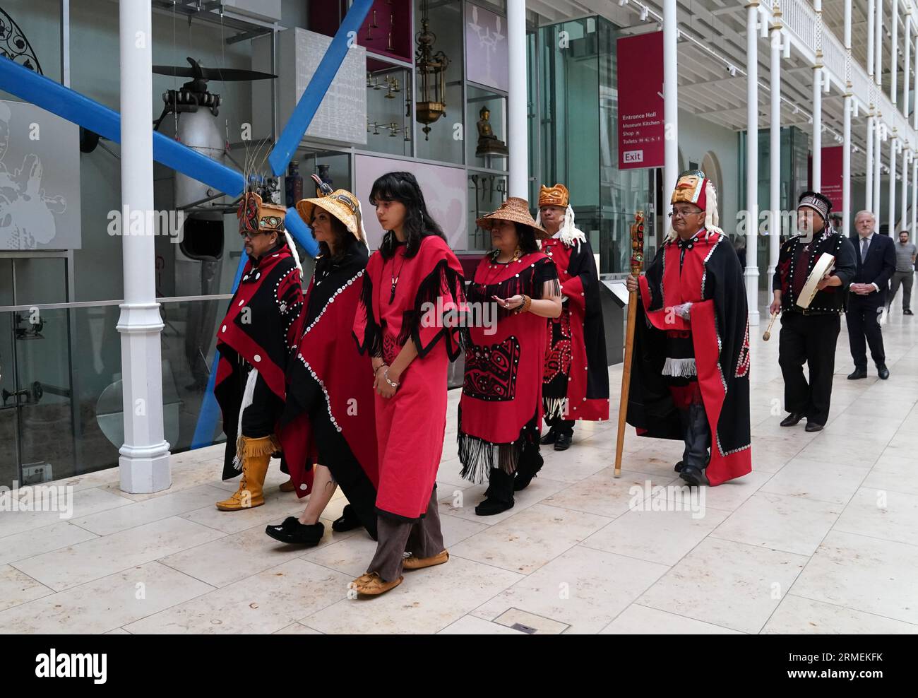 Earl Stephen's(who has the Nisga'a cultural name Chief Ni'is Joohl) and Dr Amy Parent(who has the Nisga'a cultural name Noxs Ts'aawit) lead the delegation from the Nisga'a nation as they make their way through the museum during a visit to the National Museum of Scotland in Edinburgh, ahead of the return of 11-metre tall memorial pole to what is now British Columbia. The Nisga'a Lisims Government (NLG) and National Museums Scotland (NMS) announced last month that the House of Ni'isjoohl memorial pole will return home to the Nass Valley this September. Picture date: Monday August 28, 2023. Stock Photo