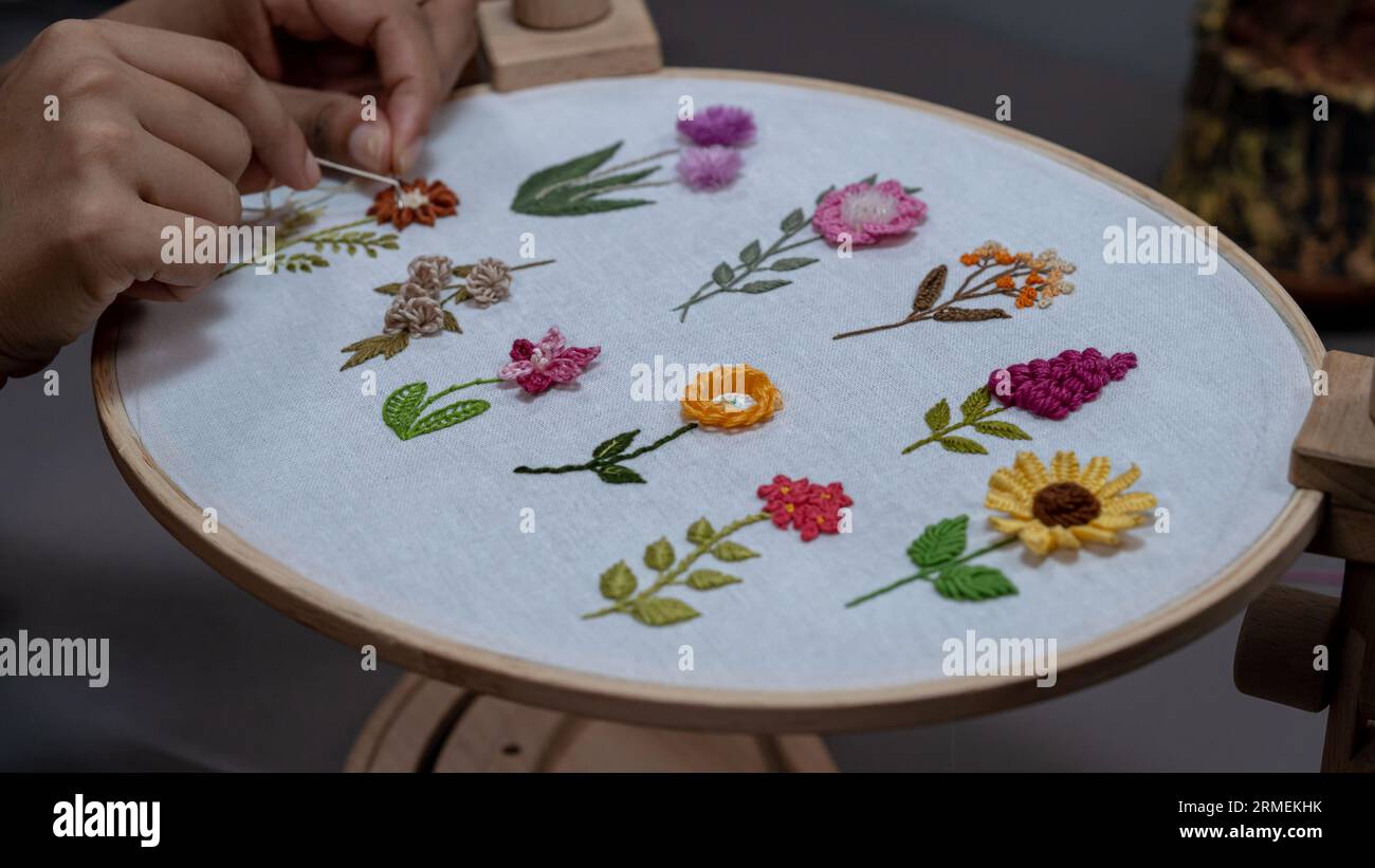 Floral Elegance: Craftswoman's Embroidery Creations Stock Photo