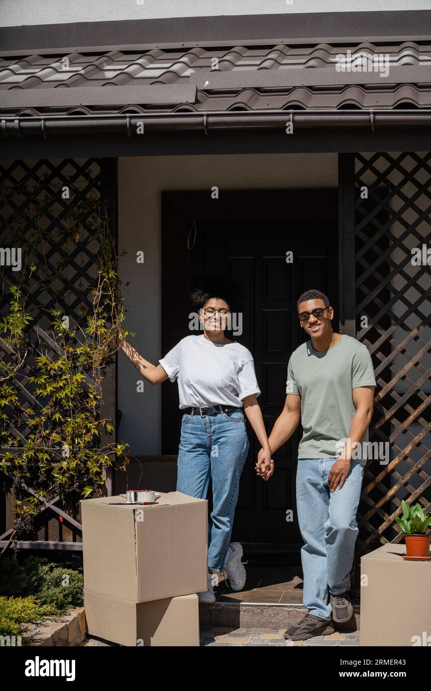 Portrait happy couple on porch hi-res stock photography and images - Alamy