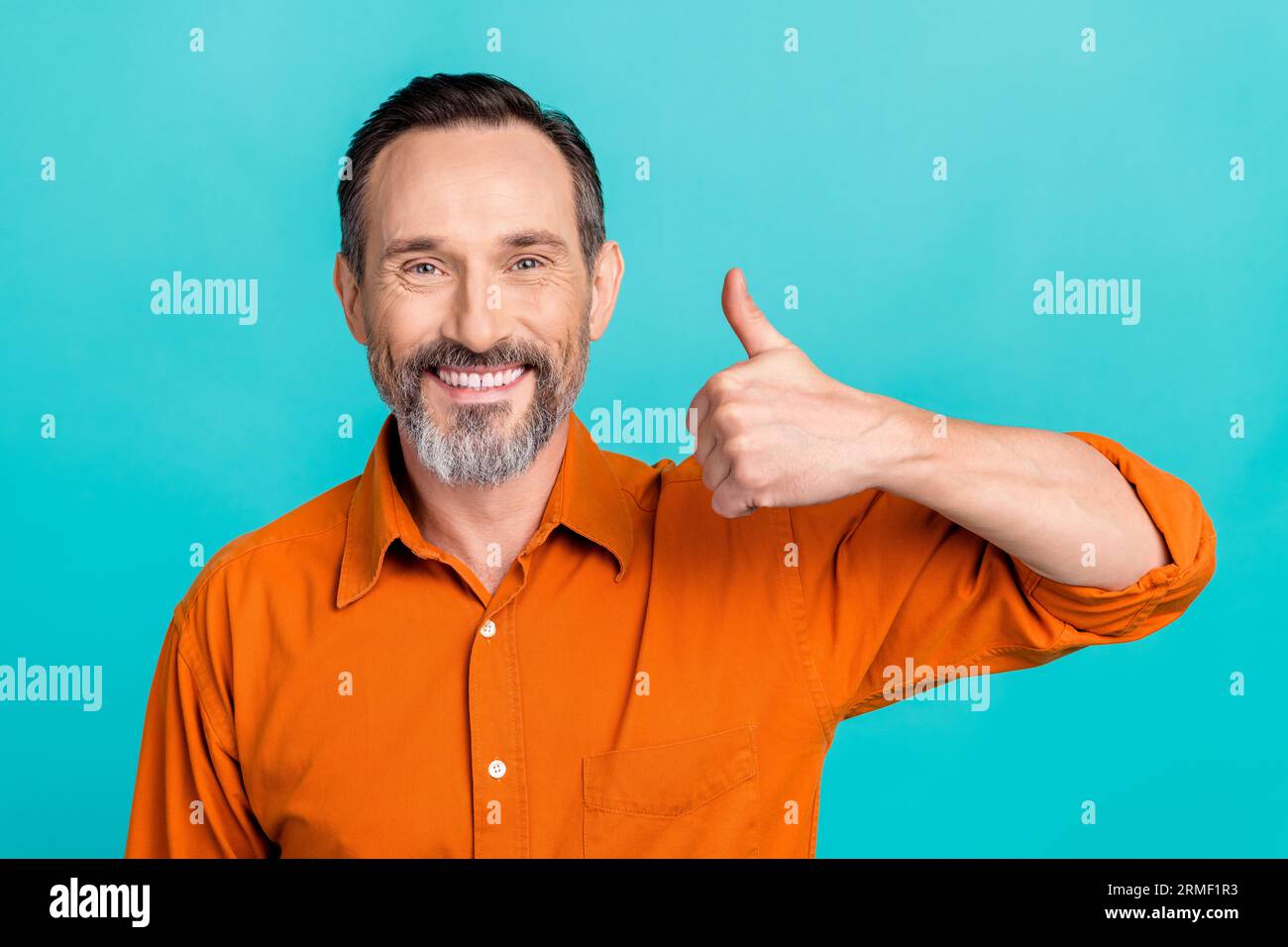 Portrait of good mood toothy beaming man dressed orange shirt with ...