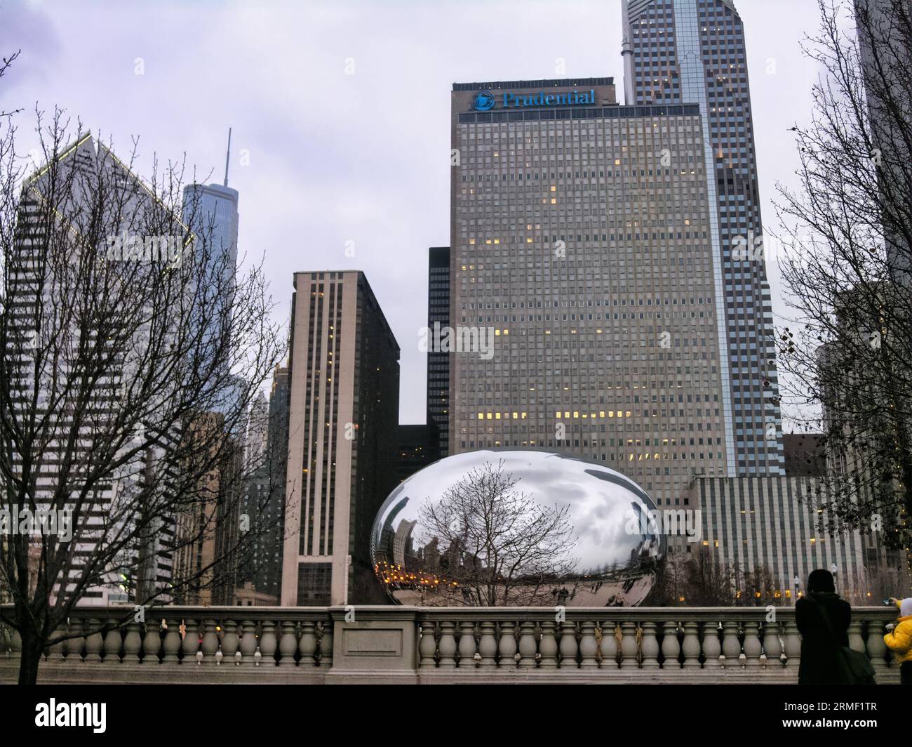 This photo shows the Cloud Gate silver sculpture in front of the