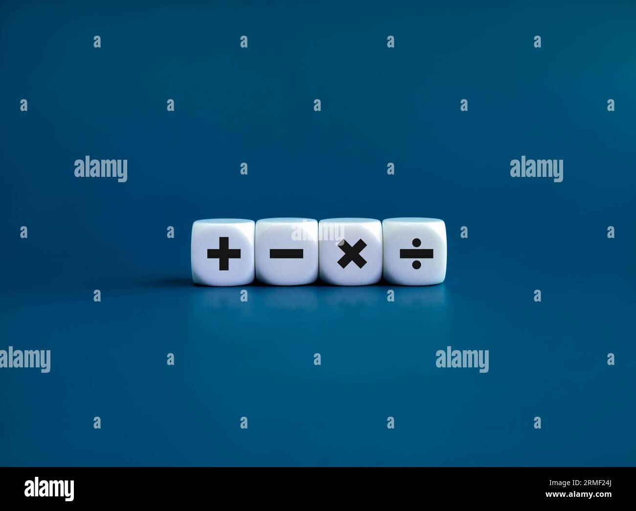 Plus, minus, multiplication and division signs on white dice cube blocks isolated on blue background, minimal style. Financial, mathematics and calcul Stock Photo