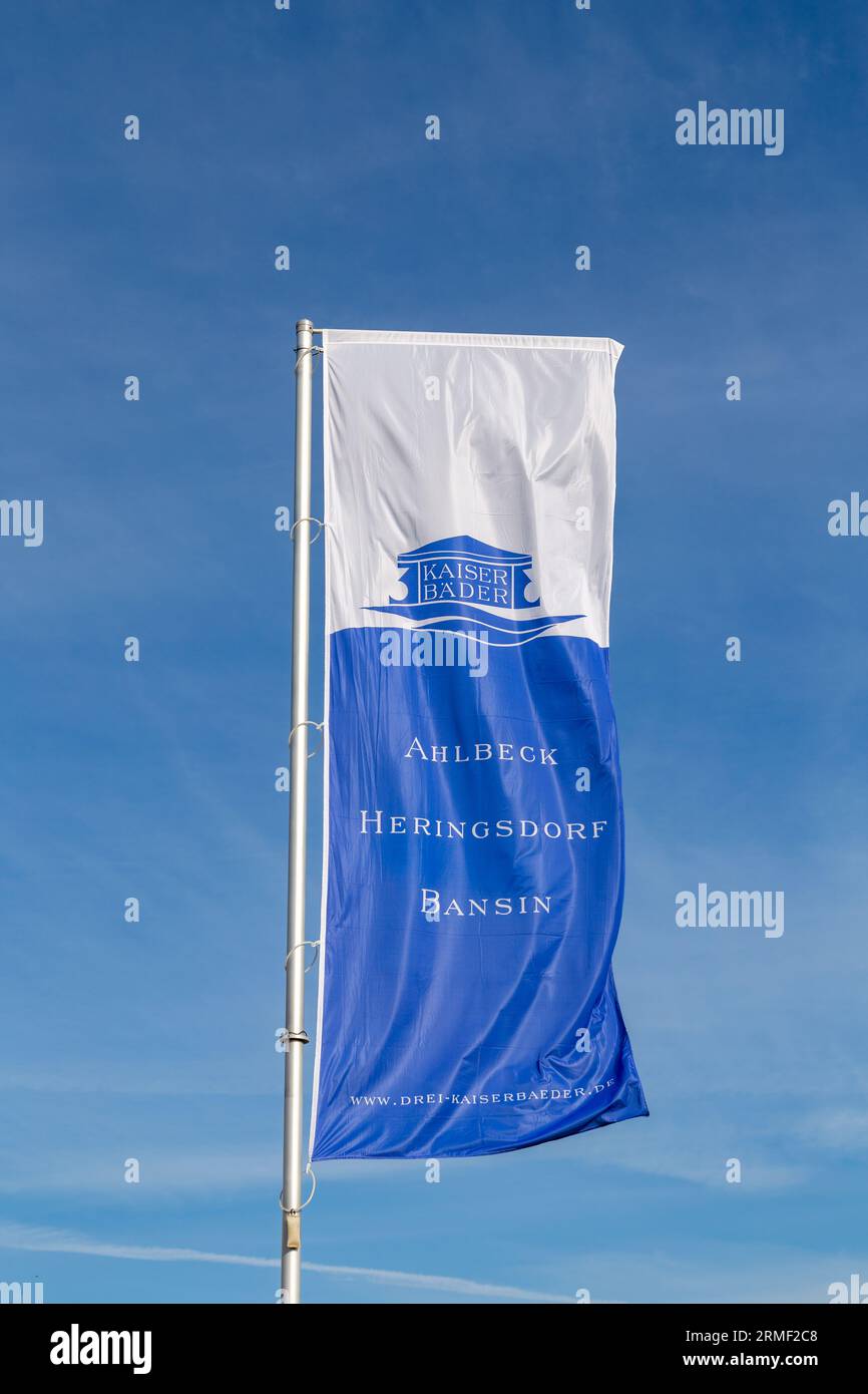 Ahlbeck, Germany - April 17, 2014: flag with inscription Ahlbeck, Heringsdorf, Bensin - 3 Kaiserbäder - engl: three kings Spa areas - fluttering in th Stock Photo