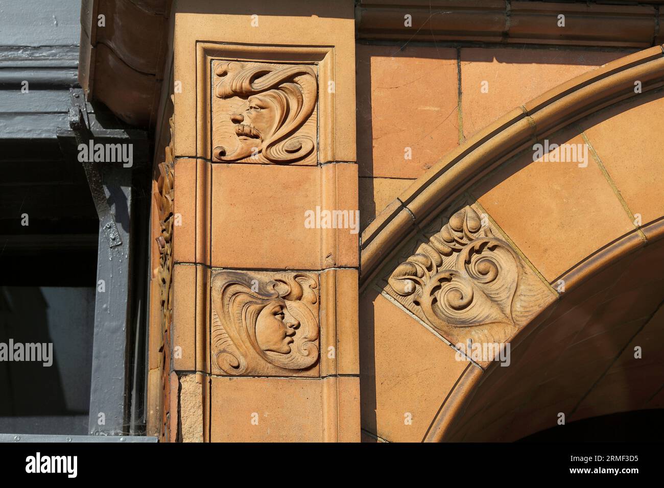 Close up of details on the facade of the Great Yarmouth Hippodrome showing terracotta tiles with art nouveau designs. Stock Photo