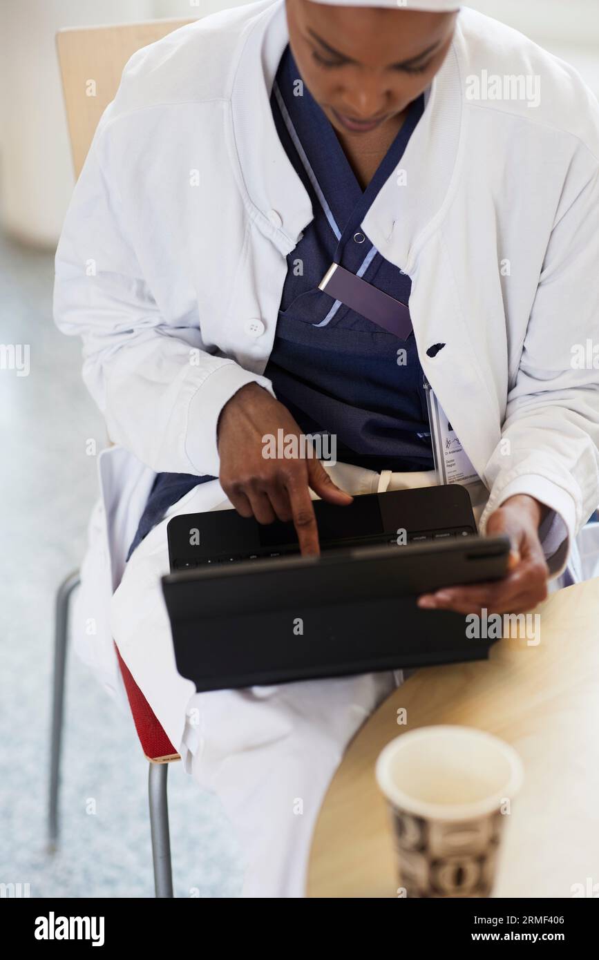 High angle view of female doctor using digital tablet Stock Photo