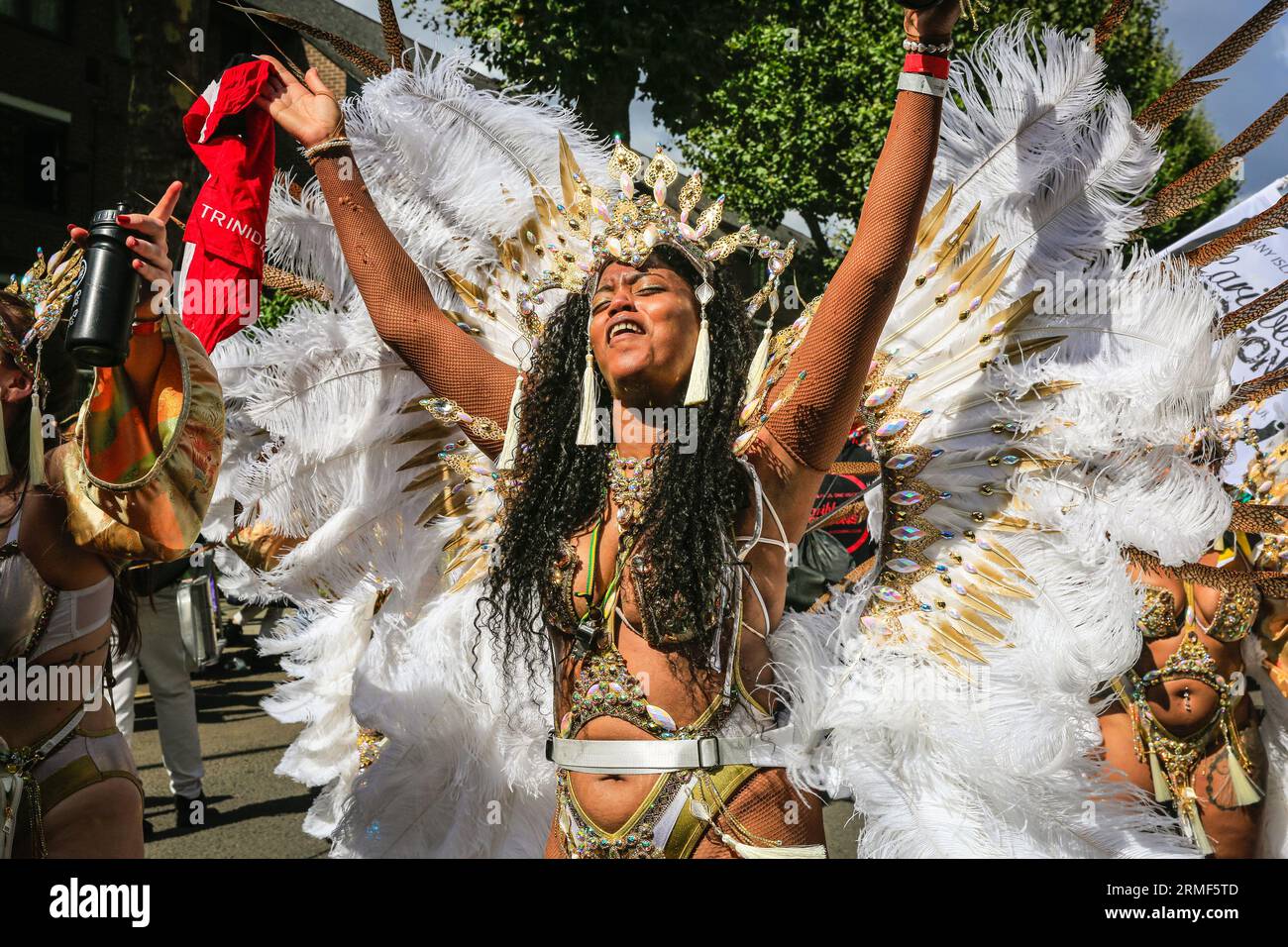 London, UK. 28th Aug, 2023. A dancer with the Aquarian Dream mas band. Participants in the main carnival parade have fun on Carnival Monday. Up to two million people are expected to celebrate the carnival this Bank Holiday Weekend participating or watching along the carnival route, at sounds systems, stalls and venues. Credit: Imageplotter/Alamy Live News Stock Photo
