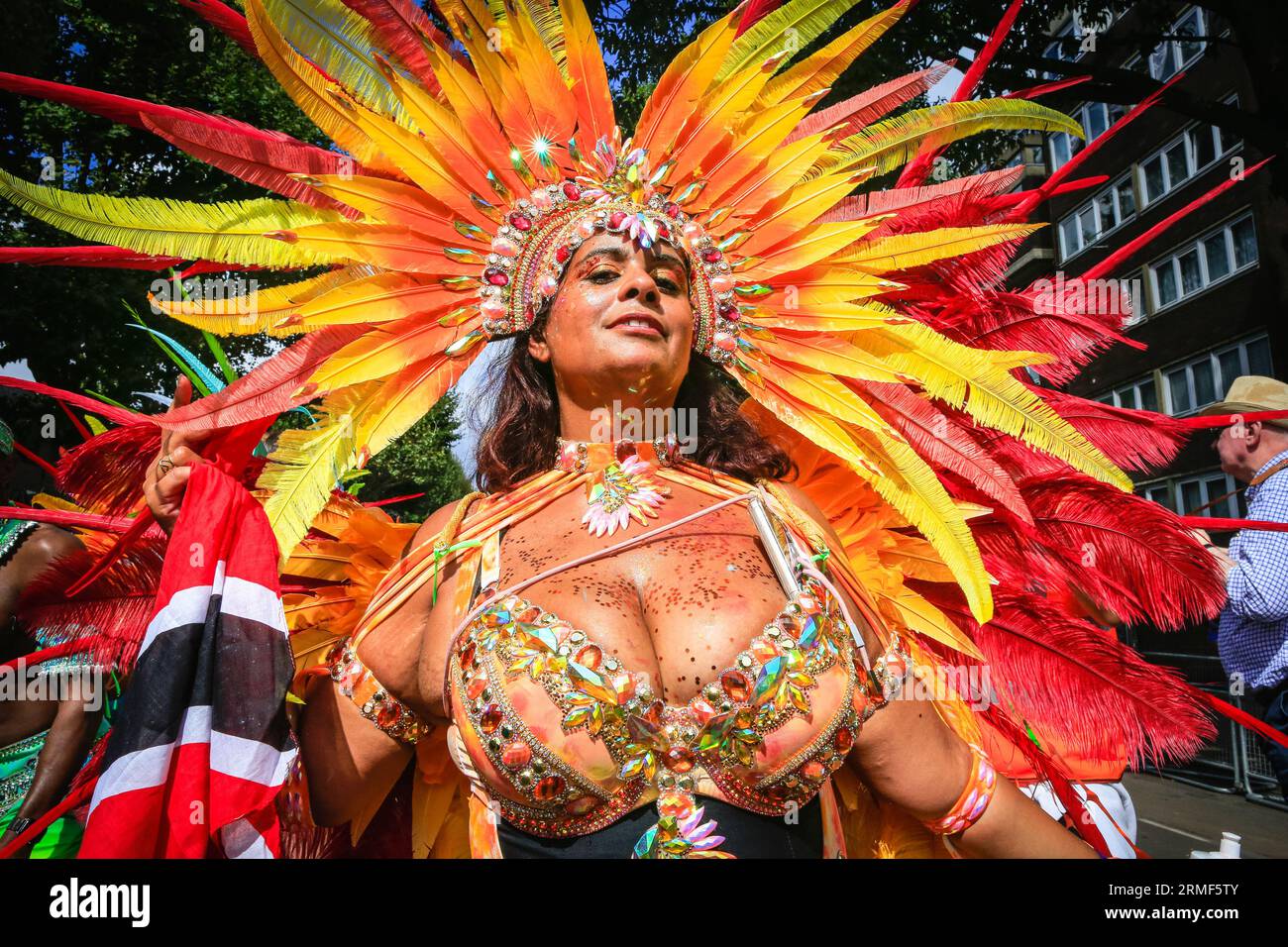 London, UK. 28th Aug, 2023. A dancer with the Aquarian Dream mas band. Participants in the main carnival parade have fun on Carnival Monday. Up to two million people are expected to celebrate the carnival this Bank Holiday Weekend participating or watching along the carnival route, at sounds systems, stalls and venues. Credit: Imageplotter/Alamy Live News Stock Photo