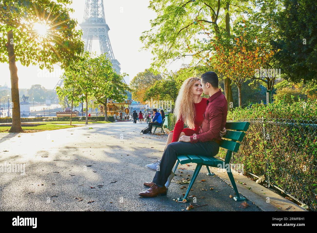 Romantic couple in love near the Eiffel tower in Paris, France Stock Photo  - Alamy