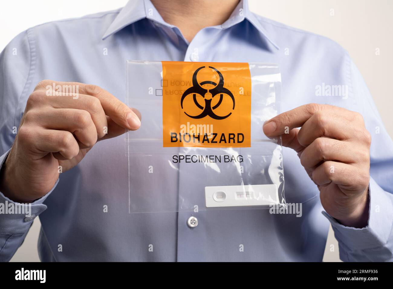 Office worker holding Biohazard Specimen Bag with Positive PCR Antigen ...