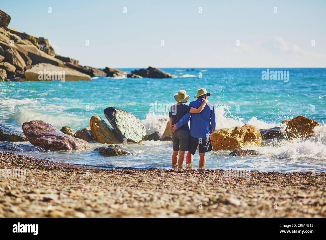 Elderly couple enjoying sea view in Vernazza, one of five famous