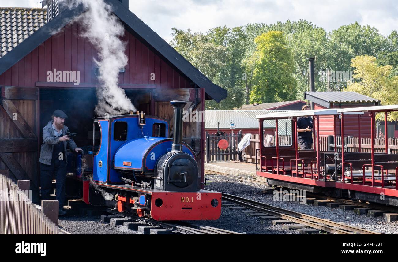 Bressingham, Norfolk, UK – August 21 2023. A small steam train on a narrow gauge railway Stock Photo