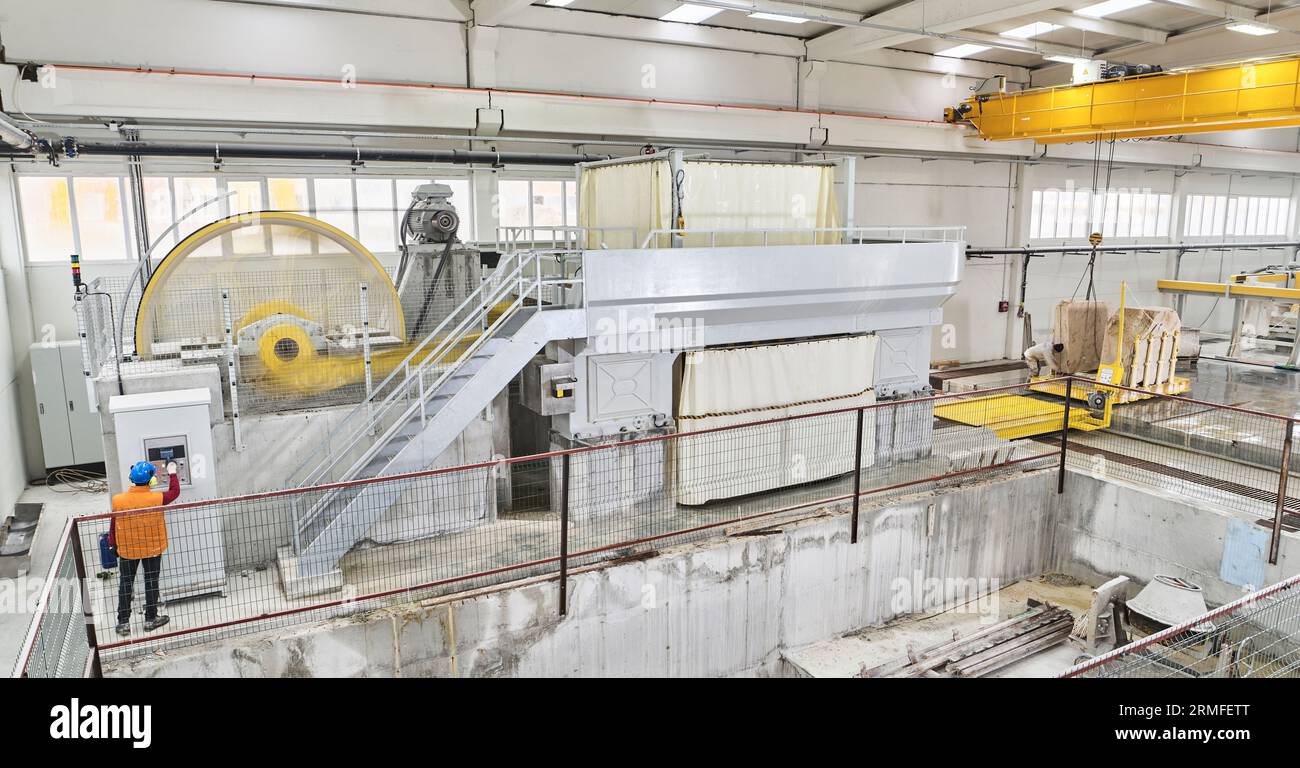 man in stone cutting stone mine. marble mine