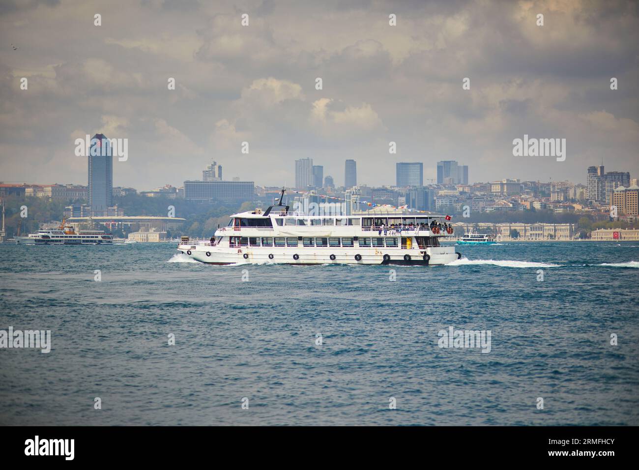 Passenger ferry sails across the Bosphorus strait in Istanbul, Turkey ...