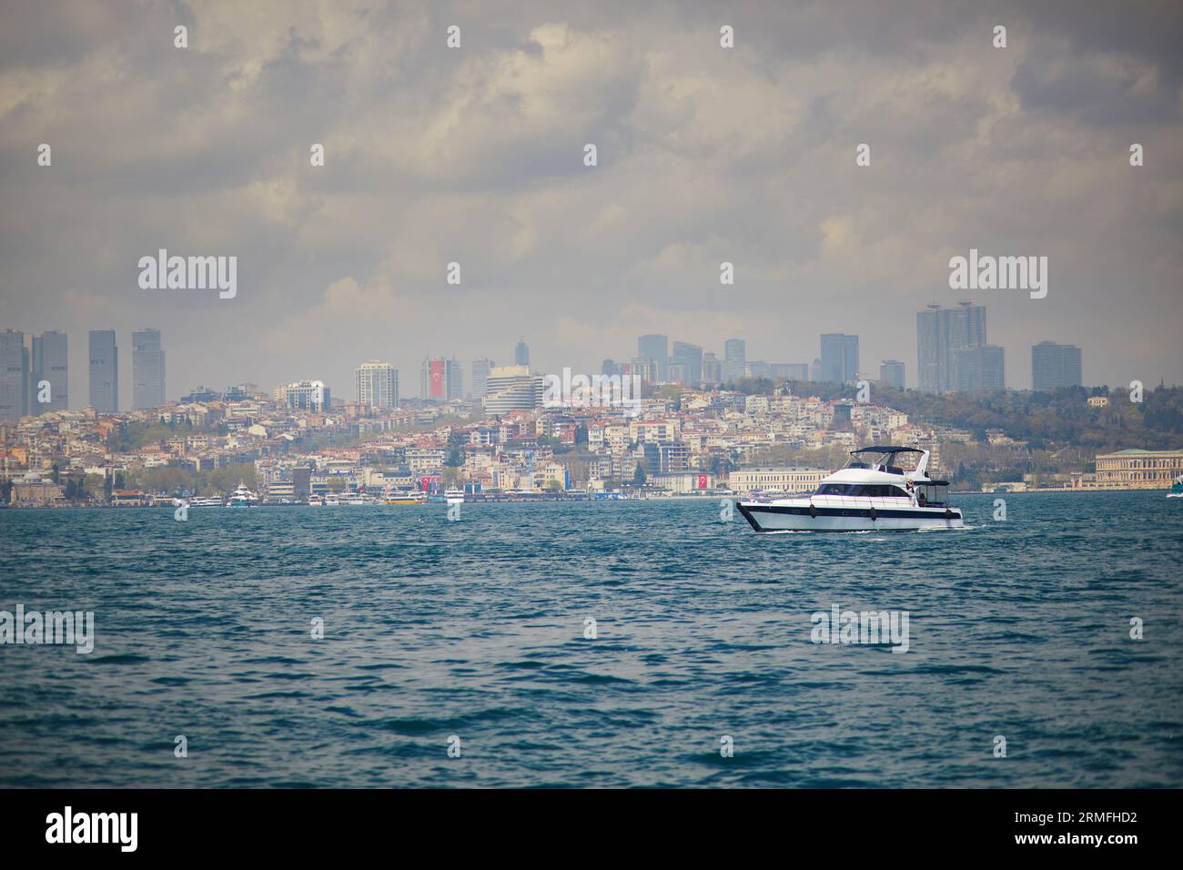 Passenger ferry sails across the Bosphorus strait in Istanbul, Turkey ...