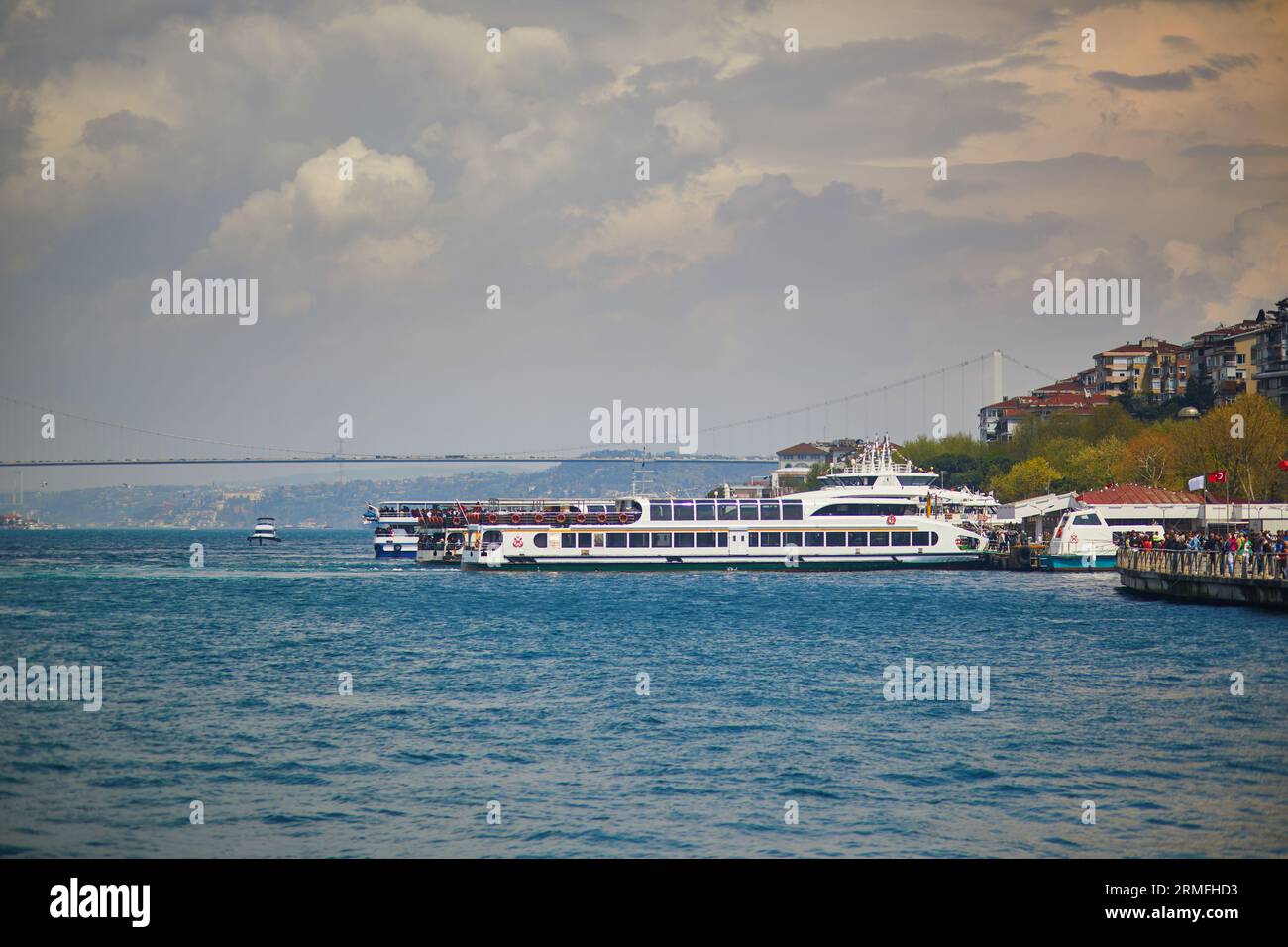 Passenger ferry sails across the Bosphorus strait in Istanbul, Turkey ...