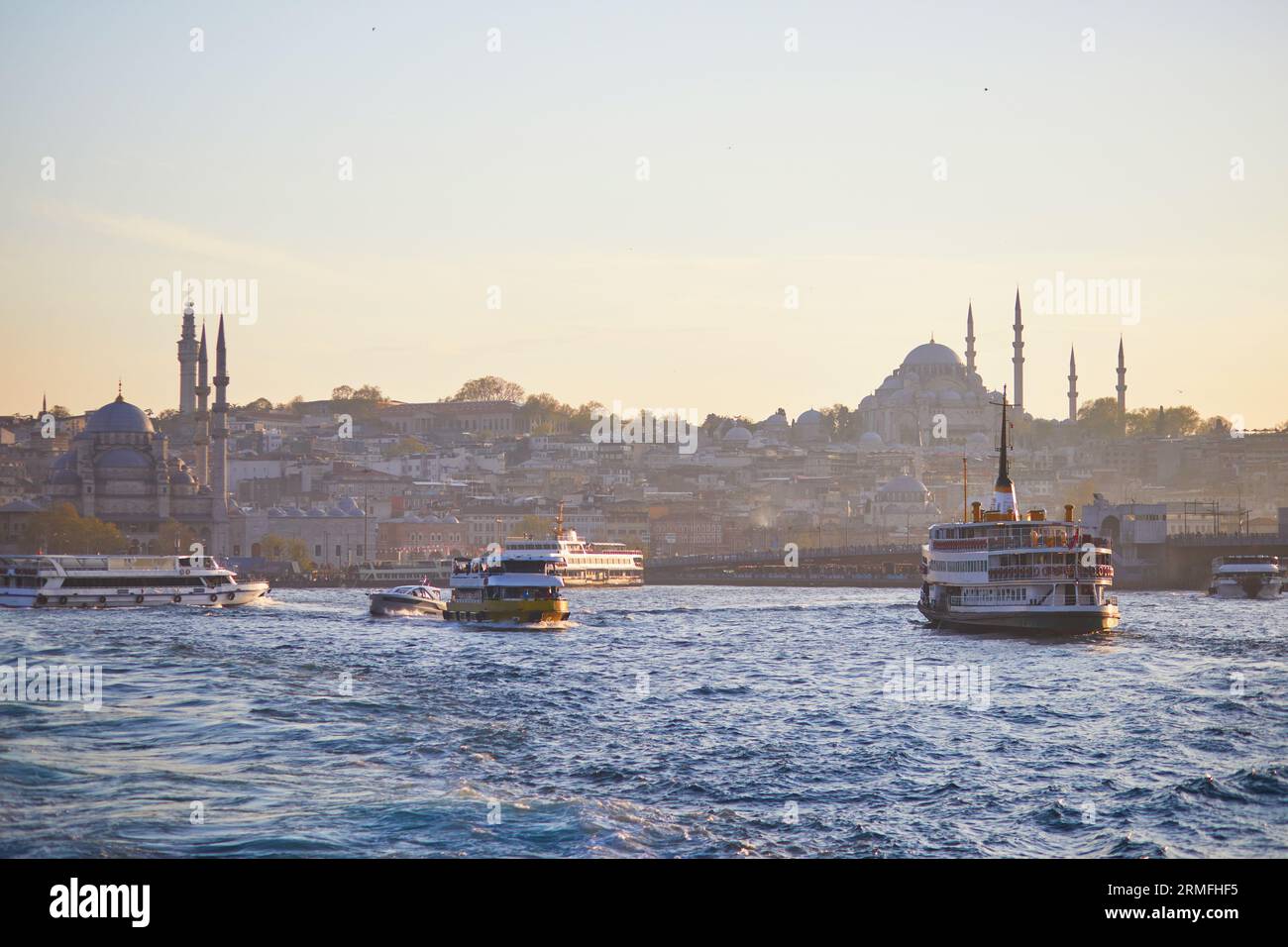 Passenger ferry sails across the Bosphorus strait in Istanbul, Turkey ...