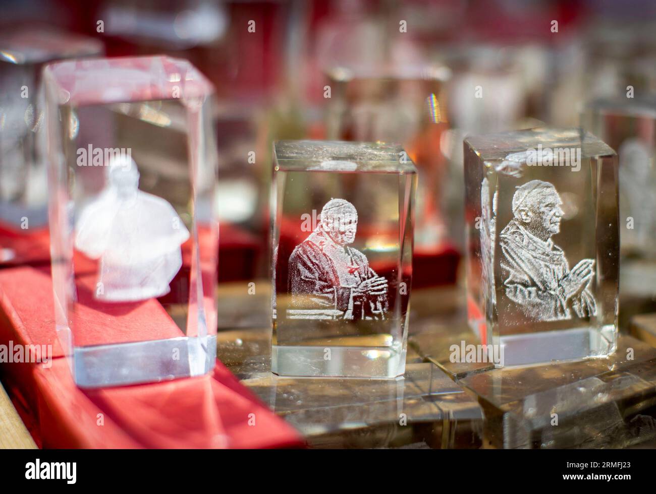 Glass trinkets of Pope John Paul II, Pope Benedict XVI and Pope Francis for sale during the Ould Lammas Fair - Ireland's oldest traditional fair - on Bank Holiday Monday in Ballycastle, Northern Ireland. Picture date: Monday August 28, 2023. Stock Photo