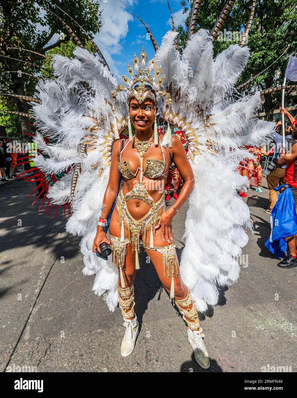 London, UK. 28th Aug, 2023. The Utopian Mas Aquarian Dream - The Monday of the Notting Hill Carnival, traditionally the main paradeday. The annual event on the streets of the Royal Borough of Kensington and Chelsea, over the August bank holiday weekend. It is led by members of the British West Indian community, and attracts around one million people annually, making it one of the world's largest street festivals. Credit: Guy Bell/Alamy Live News Stock Photo