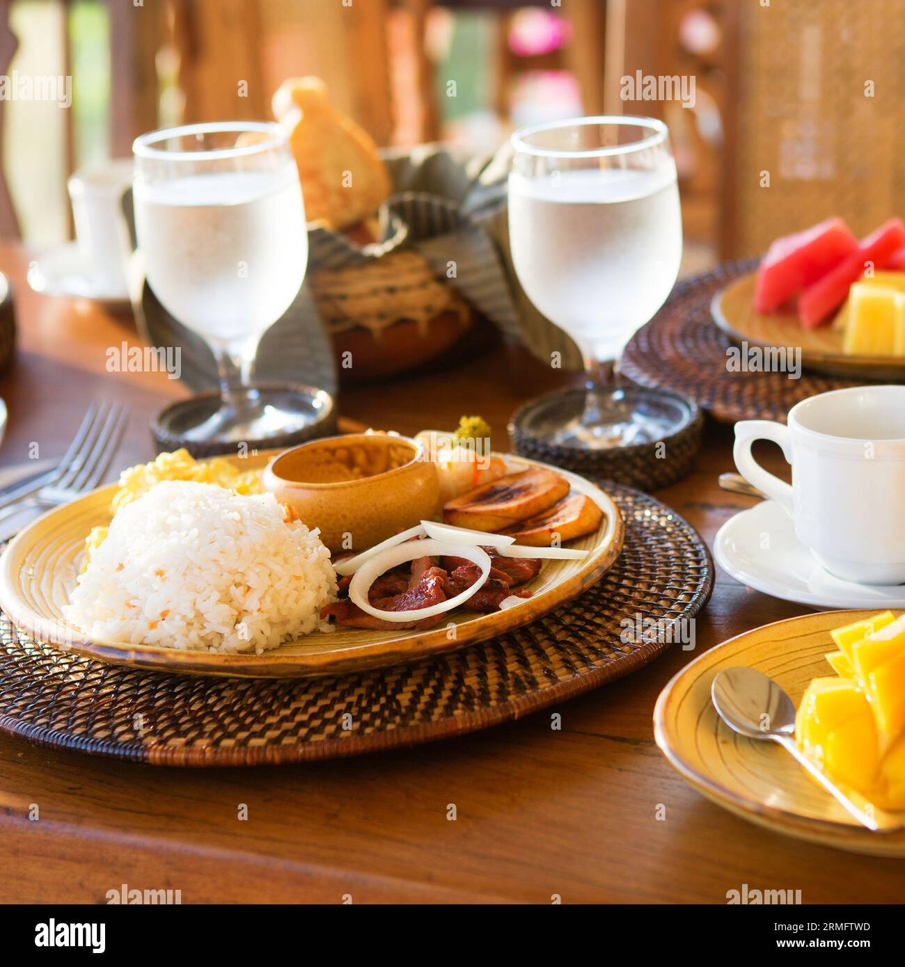 Traditional Philippino breakfast with garlic rice and adobo Stock Photo