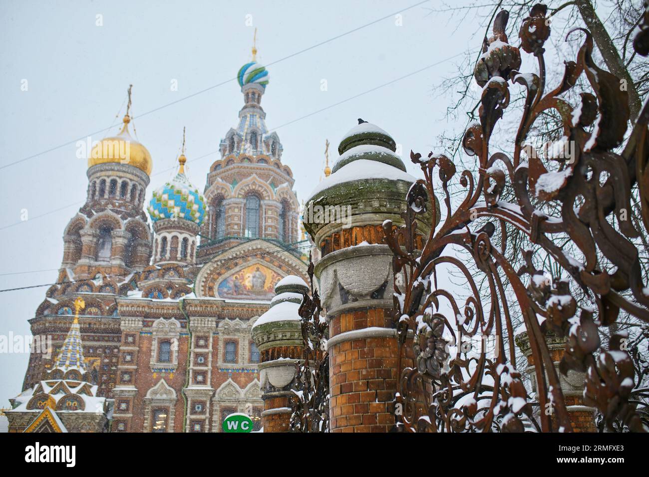 Scenic view of Savior on the Spilled Blood Church with grill of Mikhailovsky Garden on a snowy winter day in Saint Petersburg, Russia Stock Photo