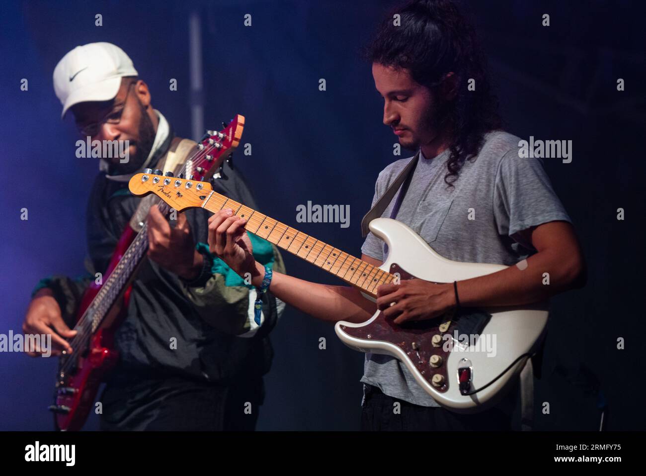Simon Martinez plays guitar with Salami Rose Joe Louis at Green Man