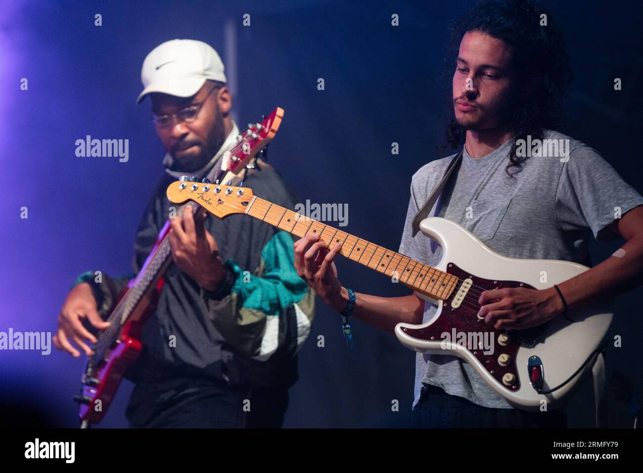 Simon Martinez plays guitar with Salami Rose Joe Louis at Green Man