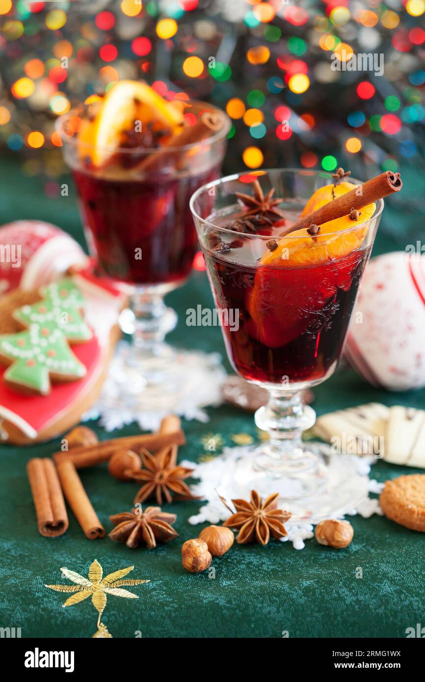 Two glasses of mulled wine, cookies and variation of Christmas spices Stock Photo