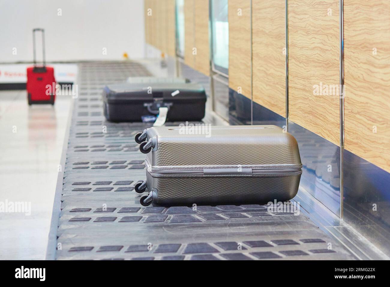 Baggage on conveyor belt at the airport Stock Photo Alamy