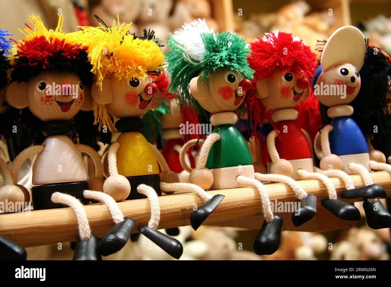 Five wooden toys of different colors Stock Photo - Alamy