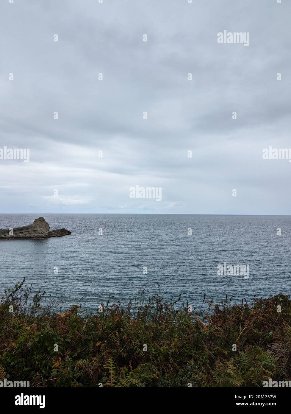 A scenic view of the coast of Langreo, Cantabria, on a cloudy day Stock Photo