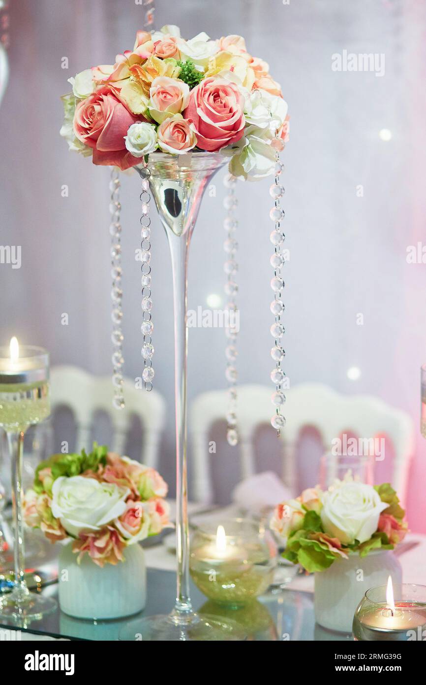 Beautiful table set with candles and flowers for a festive event, party ...