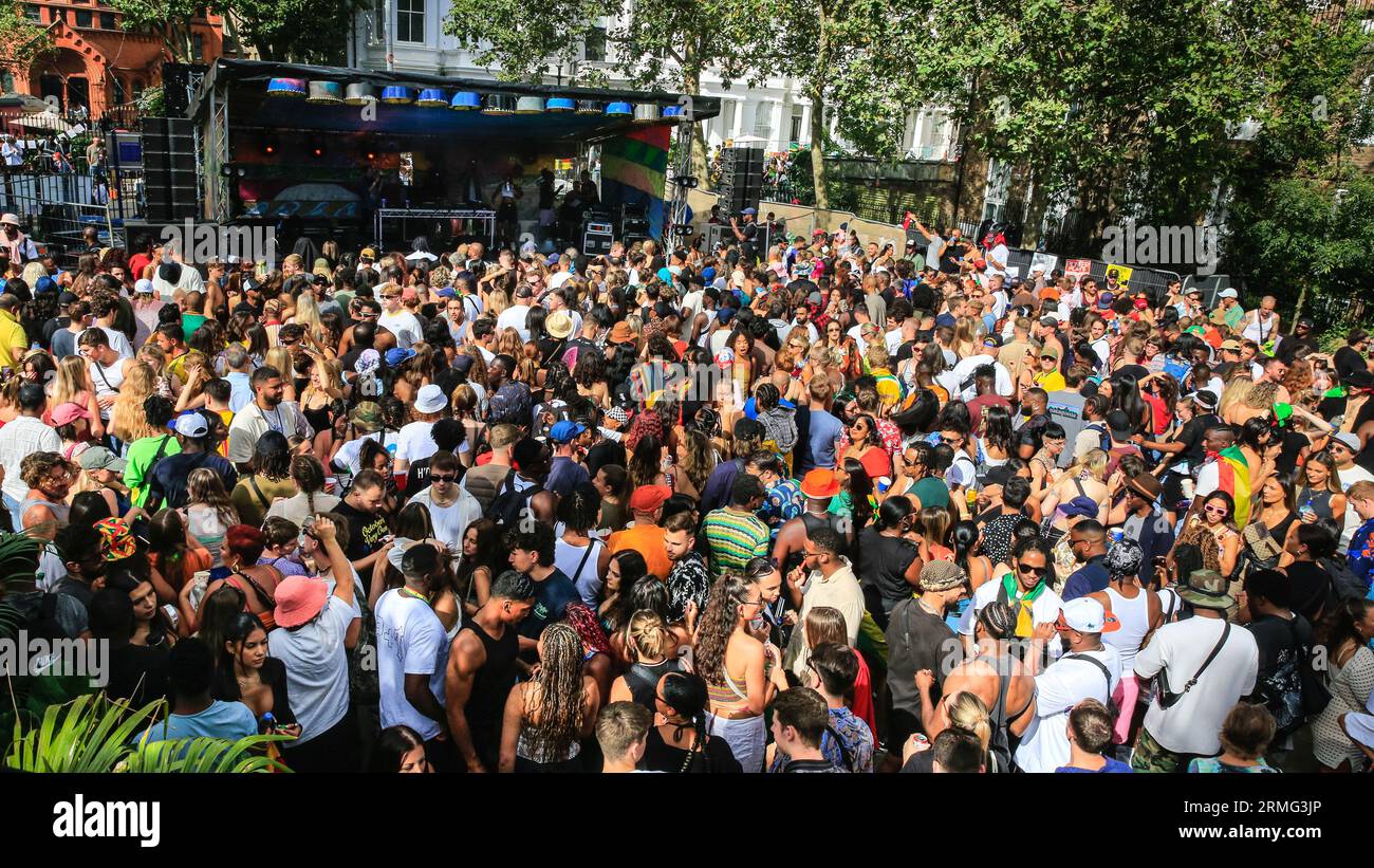 London, UK. 28th Aug, 2023. Revellers at the Powis Square stage get singing and dancing. After the parade, crowds gather in the street and around the many sound systems and food stalls on Carnival Monday. Up to two million people are expected to celebrate the carnival this Bank Holiday Weekend participating or watching. Credit: Imageplotter/Alamy Live News Stock Photo