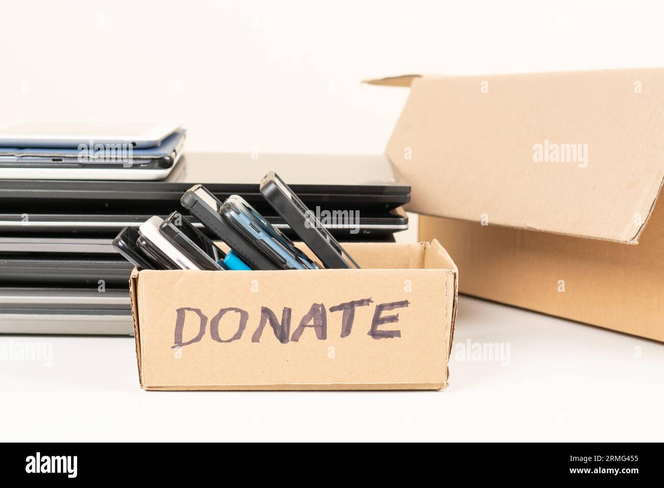 Pile of old used laptop computers, digital tablets, smartphones for