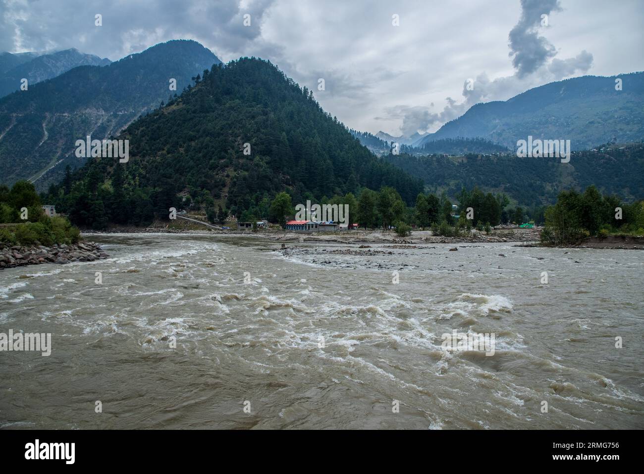 Keran Kupwara, India. 25th Aug, 2023. General view of Neelam river or Kishan Ganga that has divided Kashmir into two parts controlled by nuclear rivals India and Pakistan. The river acts as a disputed line of control and flows through a village called Keran from both sides which is located on the northern side of Indian Kashmir's Border district Kupwara some 150kms from Srinagar and 93kms from Muzaffarabad, in the Pakistan side of Kashmir. (Photo by Faisal Bashir/SOPA Images/Sipa USA) Credit: Sipa USA/Alamy Live News Stock Photo