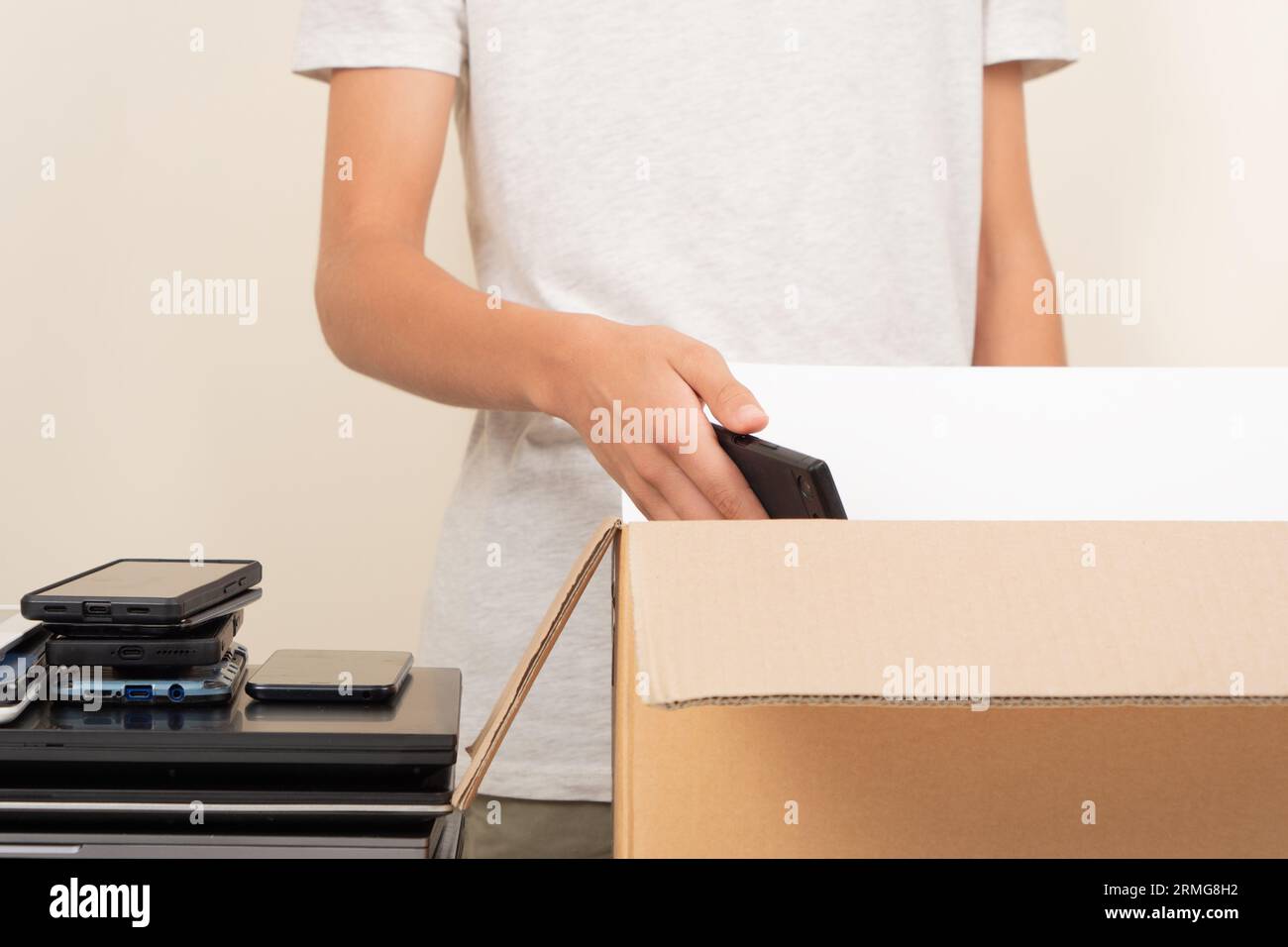 Donate technology to charity. Volunteer hands collect old used laptop