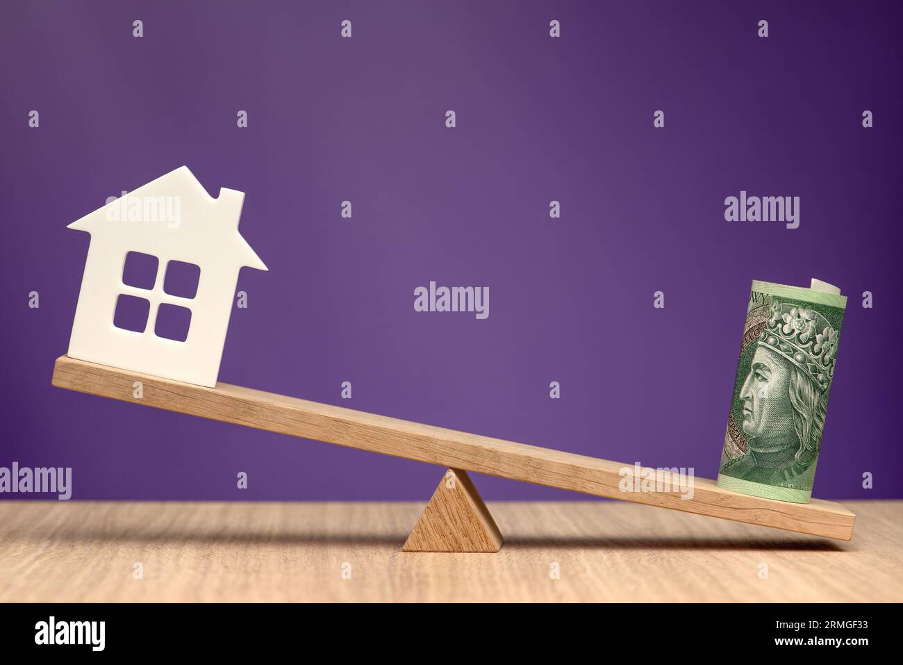 The real estate market in Poland. House symbol and zloty banknote as a