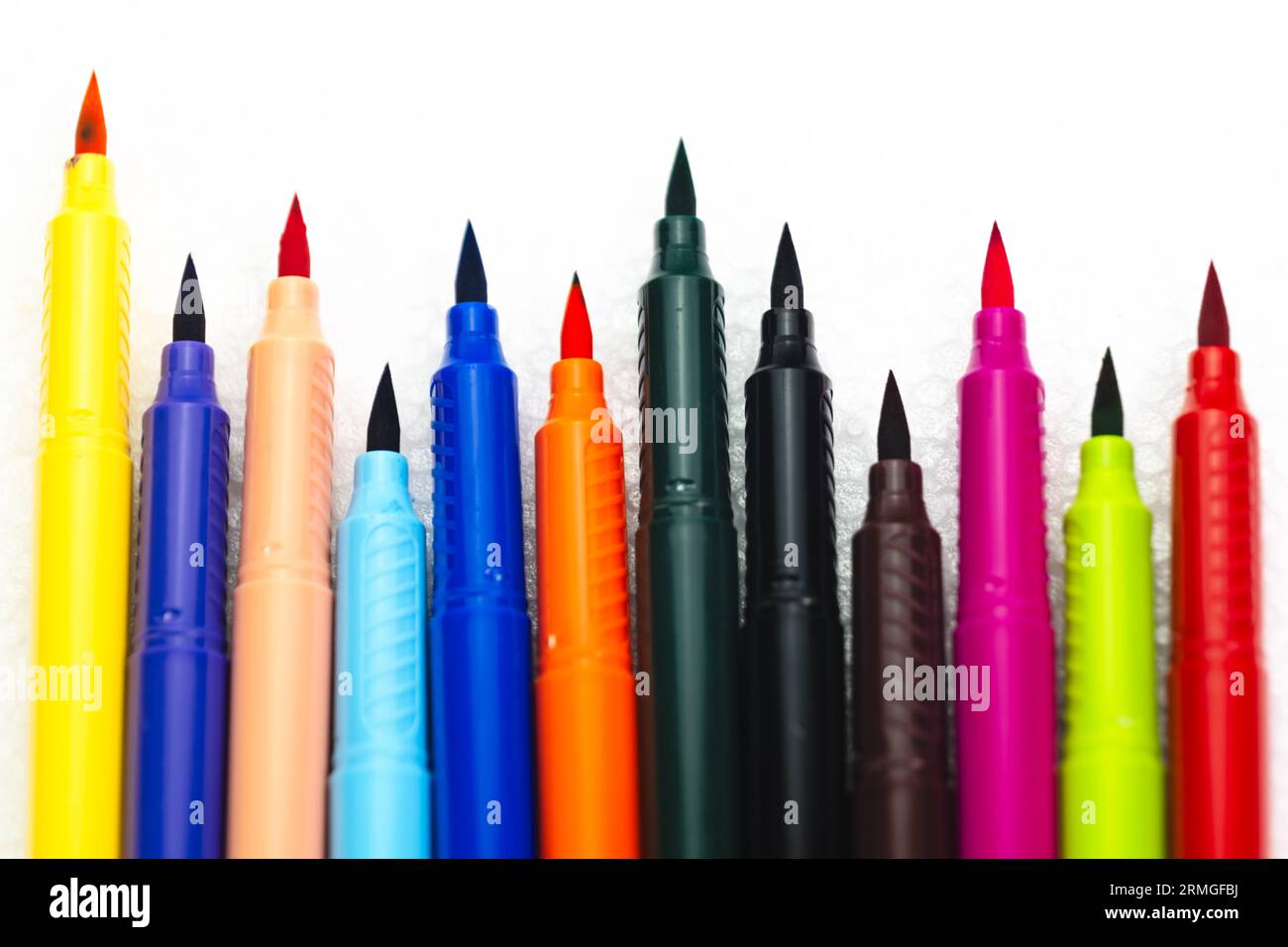 This stock image features a lineup of colorful marker pen tips on a