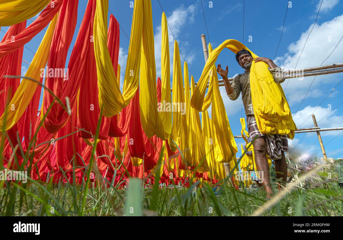 Dyed clothes of different colors are dried in the sun Stock Photo Alamy