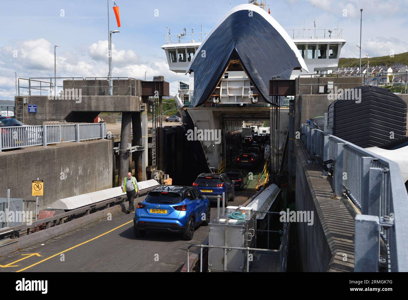 Cars loading onto the Calmac ferry at Mallaig desrined for the Outer ...