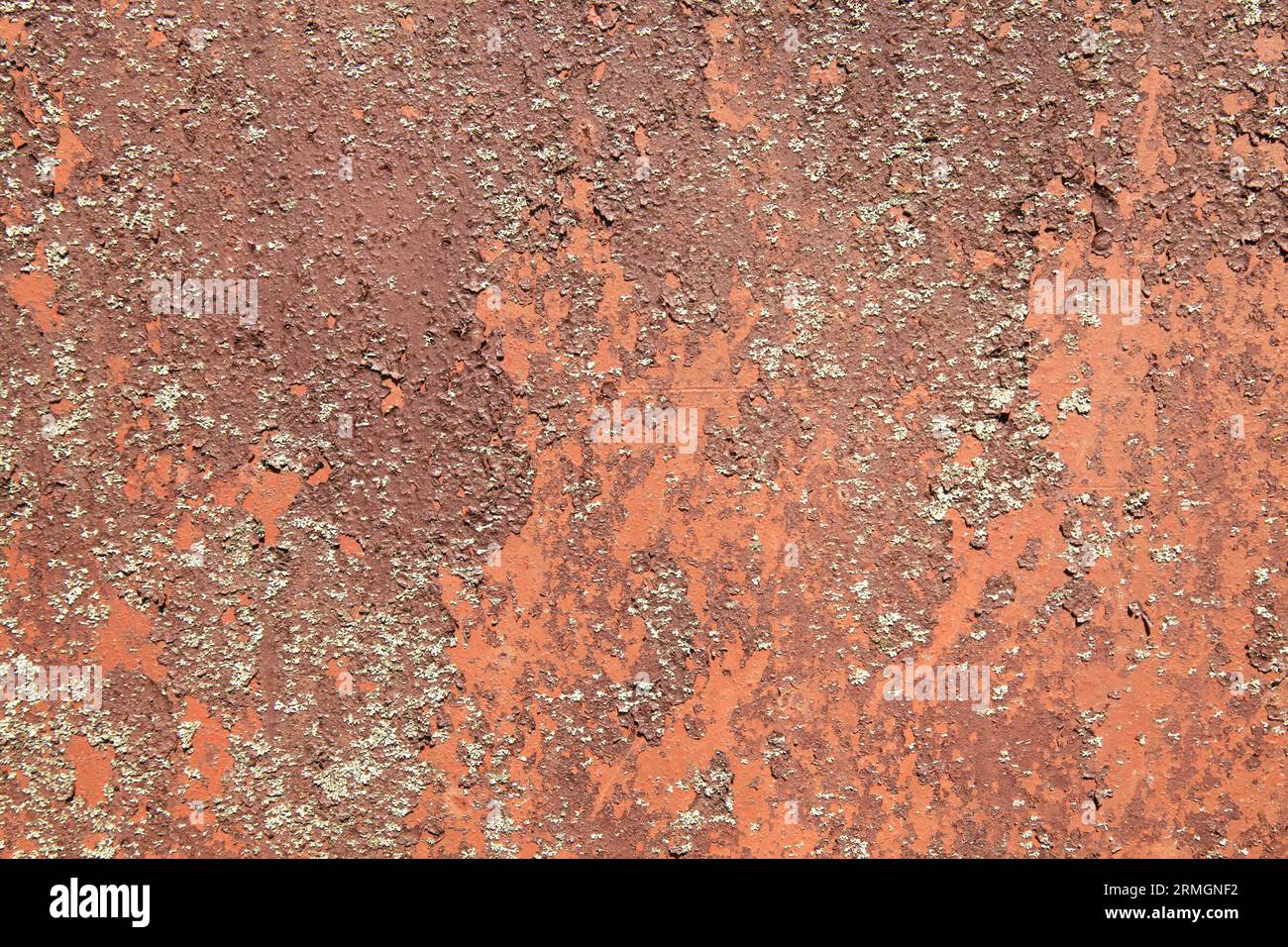 Rusted metallic background, texture. An old red and rusty surface with faded uneven color. Abstract rust pattern on light-brown metal surface Stock Photo