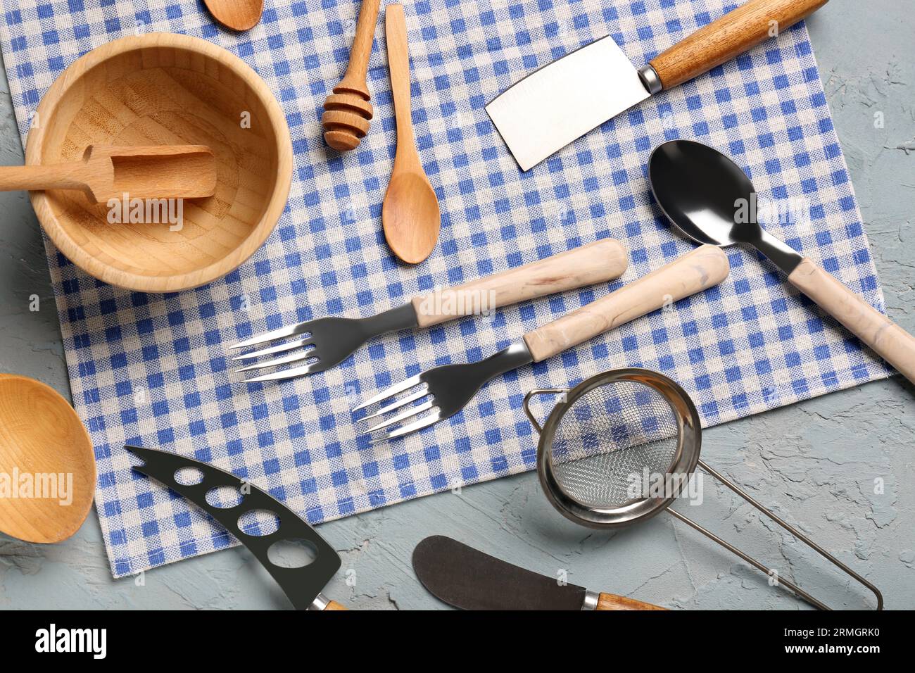 Different kitchen utensils on grey background Stock Photo